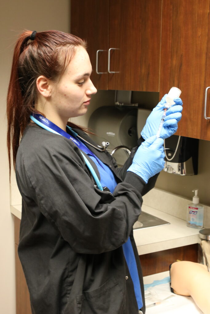 Medical Assistant with Syringe